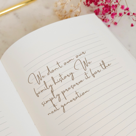 Handwritten ancestry quote in a lined journal. Displayed on a marble background with decorative elements