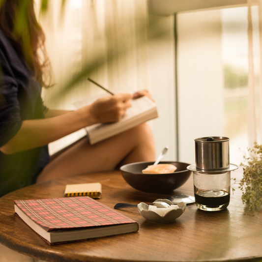 Woman writing in journal 